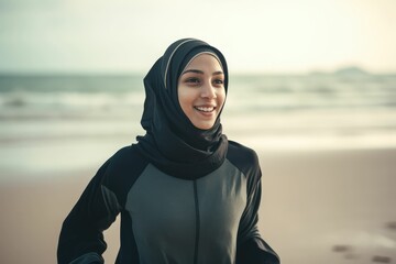 beautiful sport muslim woman smiling. healthy woman with scarf exercising