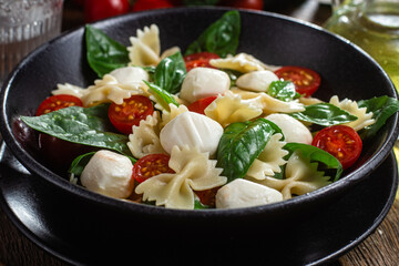 Pasta with tomato, mozzarella and basil