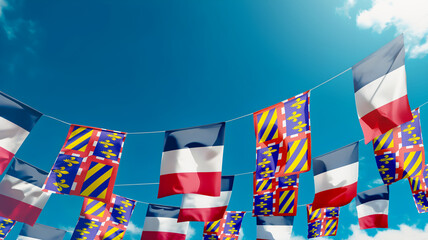 Flag of Borgona - France against the sky, flags hanging vertically - obrazy, fototapety, plakaty