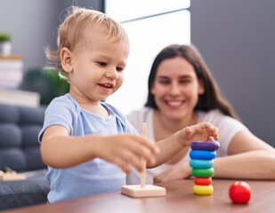 Fototapeta premium Mother and son smiling confident playing at home