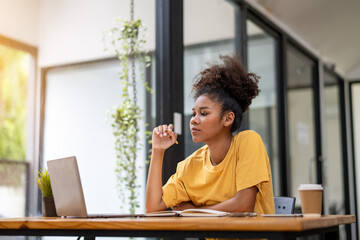 Thoughtful businesswoman think of online new project looking at laptop,  search new idea inspiration