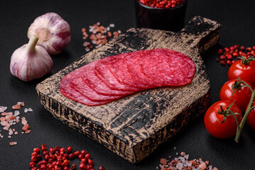 Delicious smoked salami sausage with salt, spices and herbs cut into slices