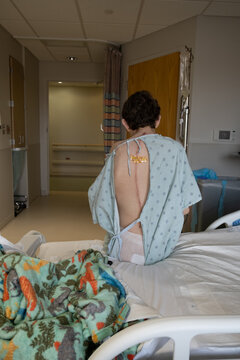 Waiting for the operation; staph infection causes wound to be reopened and cleaned post spinal fusion
