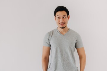 Half body portrait of smile happy asian man in grey t-shirt isolated on white.