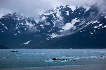 Cruise to Hubbard Glacier Bay in Alaska with floating ice bergs and drift ice floes on ocean water...