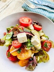 healthy summer salad with tomato fetta basil and onion
