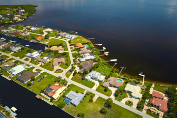 Aerial view of rural private houses in remote suburbs located on sea coast near Florida wildlife...