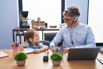 Father and daughter call center agent and student studying and working at office