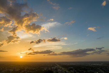 Colofrul clouds brightly illuninated by setting sun on evening sky. Changing cloudscape weather at...