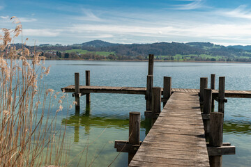 Naklejka premium Small pier at the lake Pfaeffikersee in Zurich in Switzerland