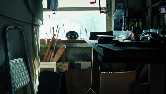 Garage Work Area With Lots Of Tools And Materials Around
