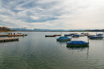 Fototapeta na wymiar Small boats on the lake Pfaeffikersee in Zurich in Switzerland
