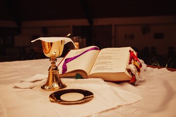 Altar of a church with chalice and bible