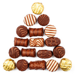 Triangle made of chocolate candies isolated on white background