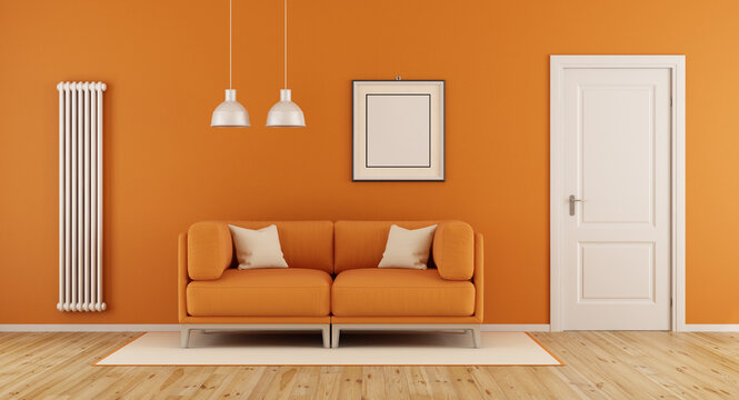 Orange living room with modern couch,closed door and vertical heater-3d rendering