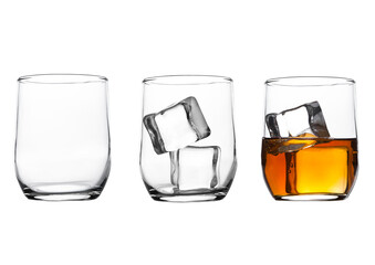 Glasses with whiskey and ice cubes and empty glass isolated