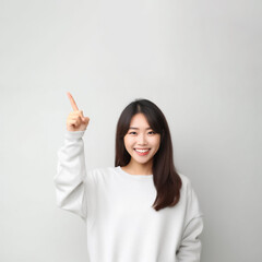 Pointing finger of an Asian girl highlights vacant space on a white background, making it a prime choice for a promotional advertising banner. Generative AI.