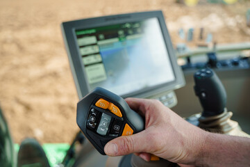 A farmer using precision agriculture and other modern farming techniques to improve agricultural profitability. The image showcases the importance of farming solutions and the use of farm equipment in