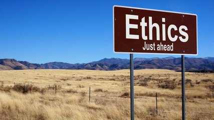 Ethics road sign with blue sky and wilderness