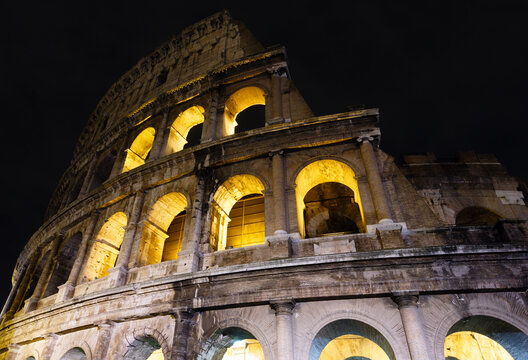Colosseum ruins night view. The symbol of Imperial Rome, Italy.