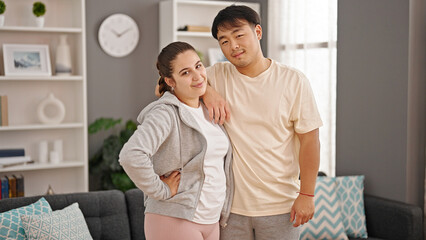 Man and woman couple smiling confident standing at home