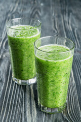 Fototapeta premium Fresh green smoothie from fruit and vegetables, healthy eating, selective focus
