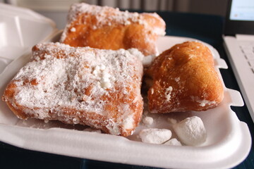 Beignets in takeout container