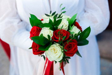 wedding bouquet in the hands of the bride close-up.