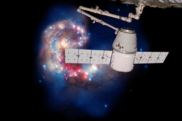 Obraz na płótnie Canvas SpaceX Dragon over spiral galaxy. Elements of this image furnished by NASA.