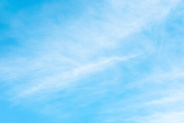 Fototapeta na wymiar Blue sky background with soft white clouds