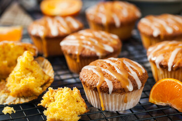 Carrot tangerine cupcakes decorated with glaze and caramel topping