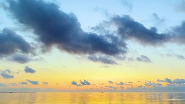 Time lapse of the ocean and clouds at dawn in Key West Florida
