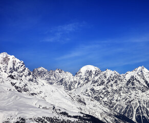 Snow mountains and blue sky in winter at sun day. Caucasus Mountains. Svaneti region of Georgia.