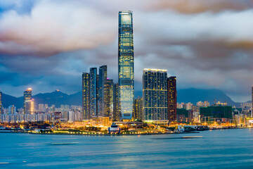 Hong Kong, China skyline of Kowloon across Victoria Harbor.