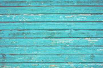 Section of turquoise blue wood panelling from a seaside beach hut. Perfect as a background for Summer Holiday or seaside themes.