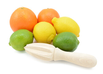Six citrus fruits - limes, lemons and oranges - with a wooden reamer, isolated on a white background