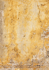 Grunge background with old stucco wall texture of yellow color