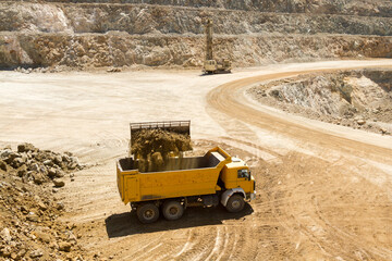 Yellow Construction bulldozer at Work in open mine