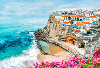 Azinheiras do Mar landscape, beach and fishing village with colorful houses of fishermen in Azenhas do Mar, Colares, Sintra, Portugal. - obrazy, fototapety, plakaty
