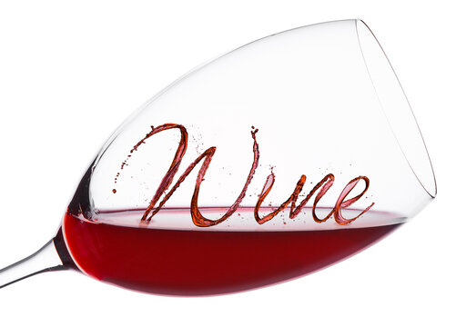 Glass of red wine with wine font splash and drops on white background