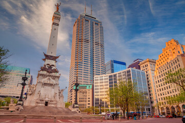 Cityscape image of downtown Indianapolis, Indiana during sunset.