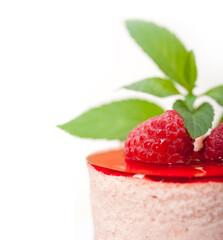 fresh raspberry cake mousse dessert round shape with mint leaves