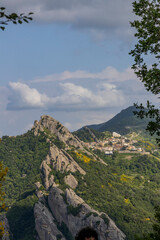 Fototapeta premium View of Pietrapertosa and Castelmezzano. Two beautiful villages built on the Lucanian Dolomites in Italy. Connected by a zipline that crosses the valley adrenaline-pumping experience. Day and sunset.