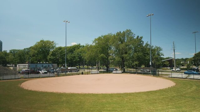 Aerial View Softball and Baseball Field in Downtown Halifax, Canada Filmed with a Cinematic Drone During the Daytime with Green Grass and Trees on a Summer Day.