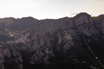 View of Pietrapertosa and Castelmezzano. Two beautiful villages built on the Lucanian Dolomites in Italy. Connected by a zipline that crosses the valley adrenaline-pumping experience. Day and sunset.