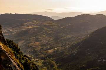 Fototapeta premium View of Pietrapertosa and Castelmezzano. Two beautiful villages built on the Lucanian Dolomites in Italy. Connected by a zipline that crosses the valley adrenaline-pumping experience. Day and sunset.
