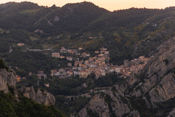 Fototapeta na wymiar View of Pietrapertosa and Castelmezzano. Two beautiful villages built on the Lucanian Dolomites in Italy. Connected by a zipline that crosses the valley adrenaline-pumping experience. Day and sunset.