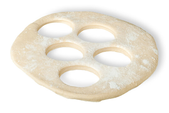 Roll dough with hole cut out isolated on white background