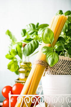 Italian cuisine. Pasta with olive oil, garlic, basil and tomatoes. Spaghetti with tomatoes