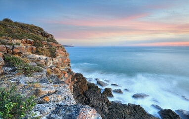 Beautiful ambient light on the rocks at dusk and coastal views over the ocean.  Location: ...
